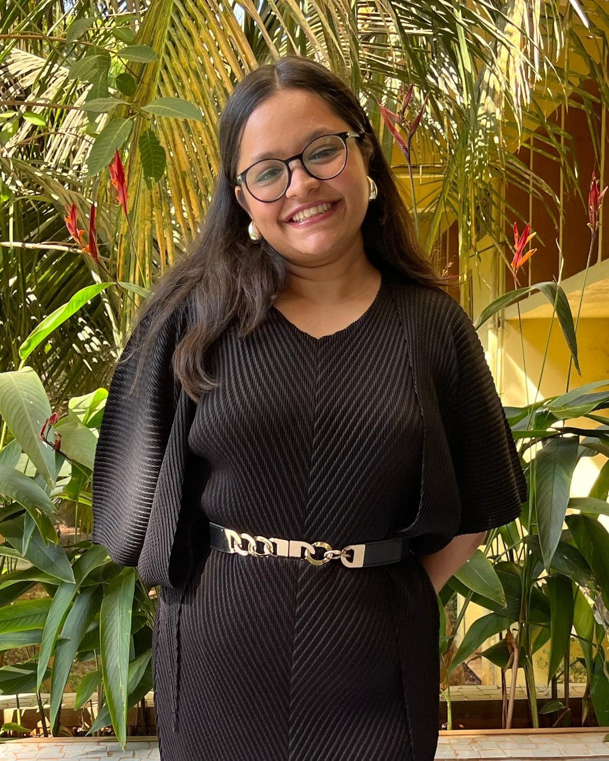 Irika Goyal, clinical dietitian, smiling in a garden
